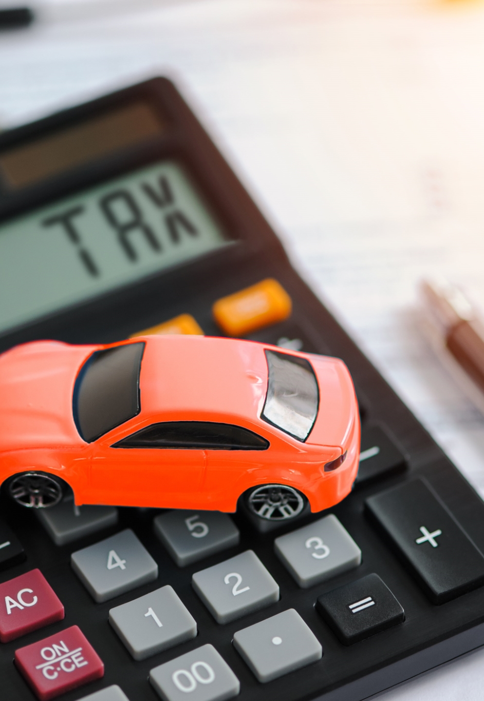 Person calculating car loan budget